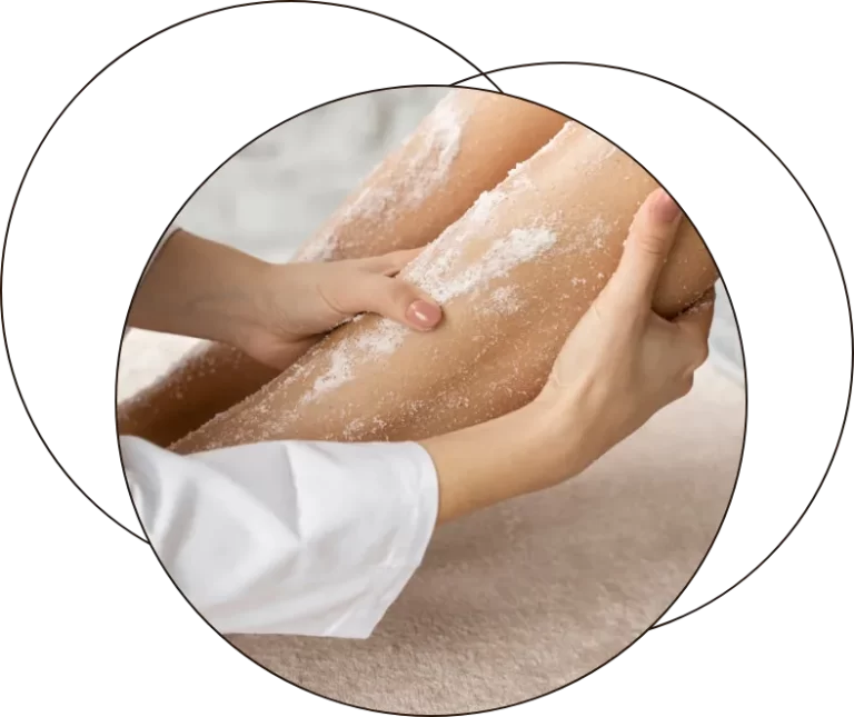 A therapist working on a client's hands during a treatment